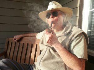 Robinson_with_pipe_on_porch_2015